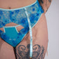 Blue lace lingerie with a white background