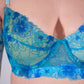 Blue floral lace bra on a plain background