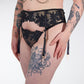 black lace garter belt with chains on a white background