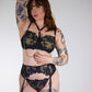 black lace bra with chains on a white background
